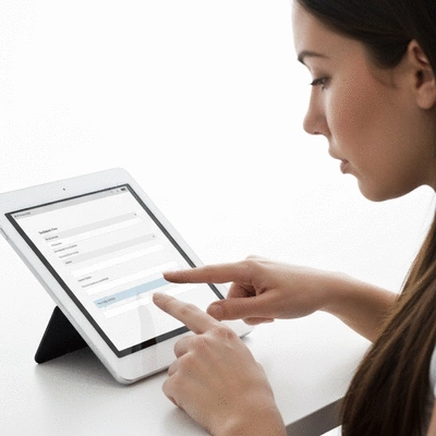 User submitting online form on tablet